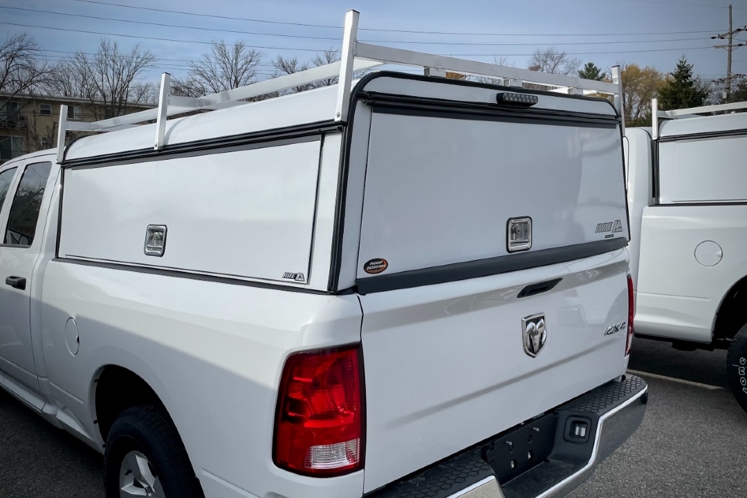 A.R.E. commercial aluminum cap with heavy-duty roof ladder rack